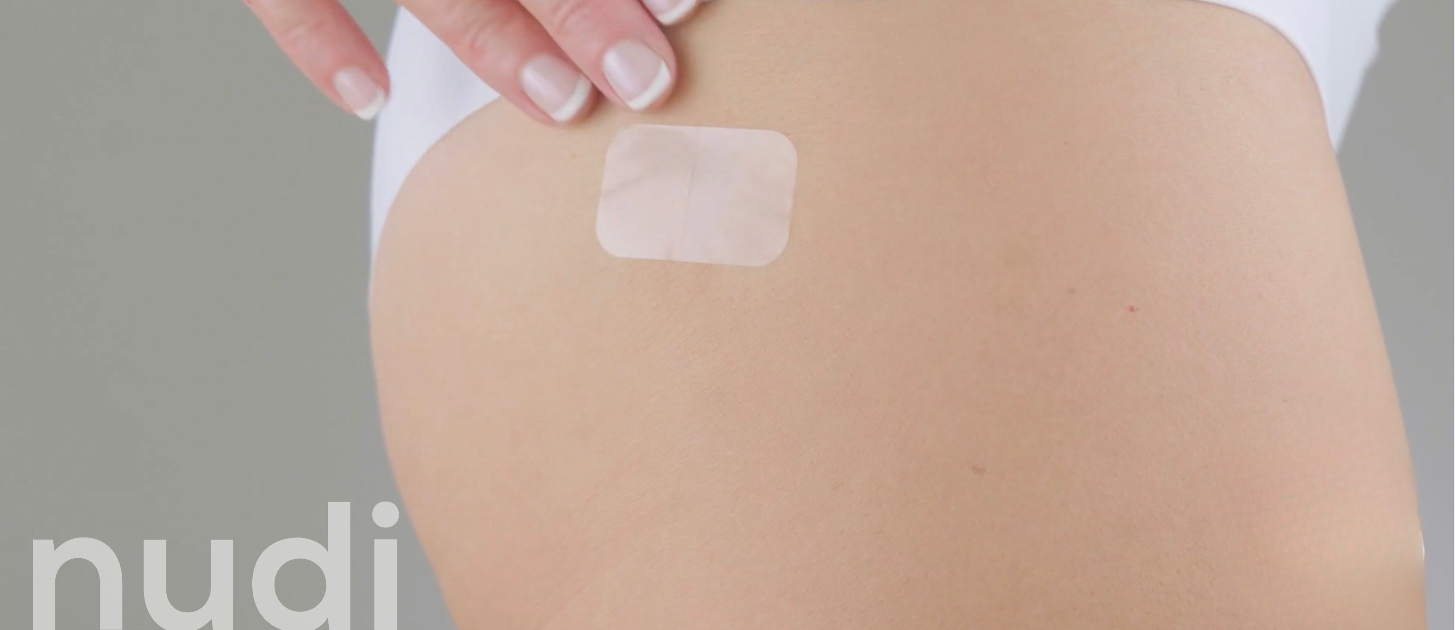 Graphic demonstrating the gentle removal of transdermal medical adhesive residue using a specialised skin safe spray and a non abrasive applicator pad